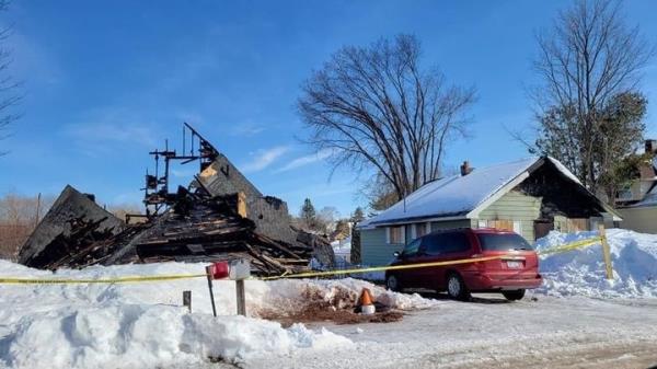 The remains of the Michigan house following the fire that killed Andrews.