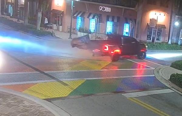 The lifted pickup truck, with LED underbody lights and a flag attached to the back, was caught on camera spinning its tires across the LGBTQ pride mural on Feb. 4, 2024, in Delray Beach, Florida.