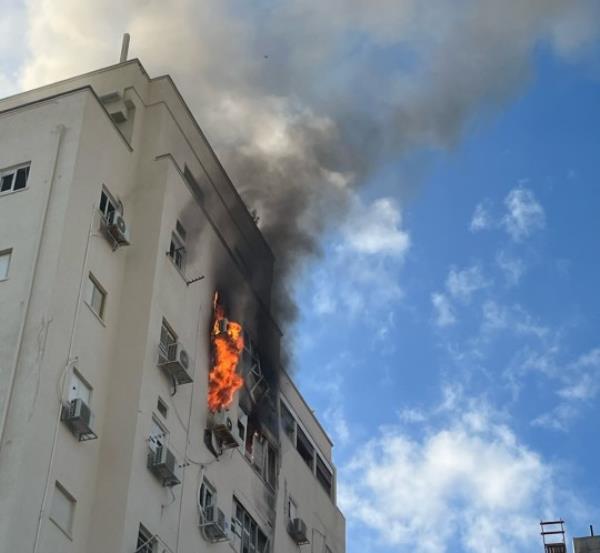 Bobby Lax captured the scene after a residential building two doors away was hit by a Hamas missile 