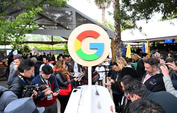 Members of the media examining new Google products during the Google I/O event at Shoreline Amphitheatre in Mountain View, California in 2023