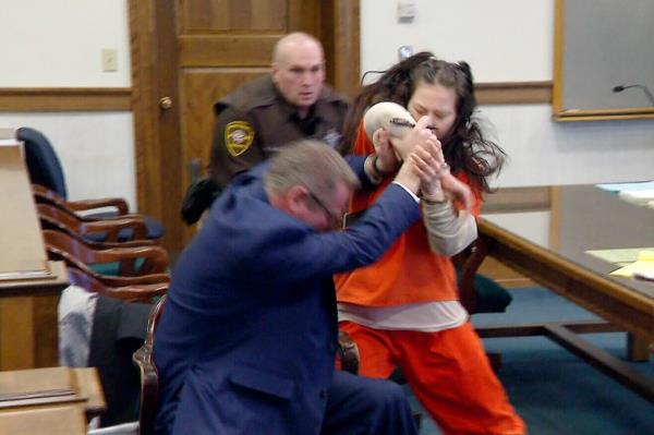 aylor Schabusiness attacks her attorney, Quinn Jolly, in Brown County court in Green Bay, Wis., on Feb. 14, 2023.