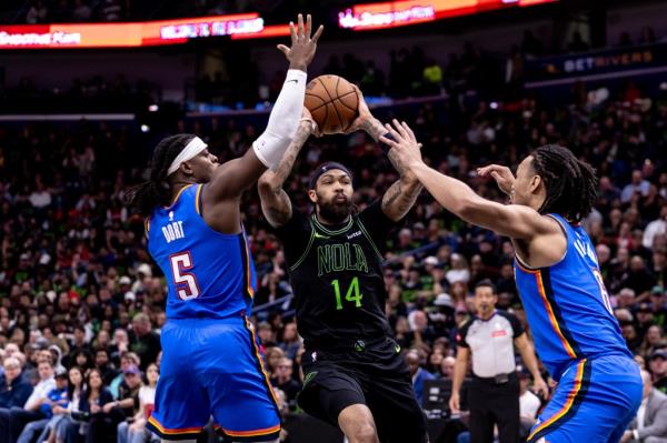 Pelicans forward Brandon Ingram (14) dribbles against Oklahoma City Thunder guard Luguentz Dort (5) during the first half of game four of the first round for the 2024 NBA playoffs.