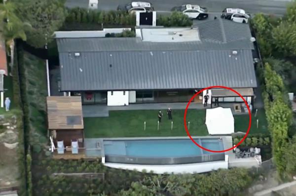 A white crime scene tent is seen in the backyard of Matthew Perry's home on Saturday.