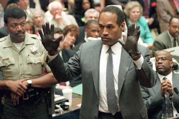 OJ holds hands up in gloves