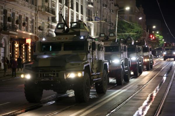 Wagner vehicles driving down a Rostov-on-Don street.