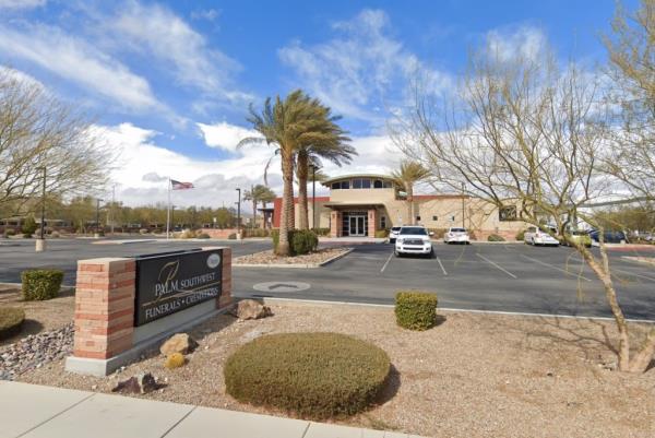 A building of Palm Southwest Mortuary with palm trees and a sign in Las Vegas, Nevada