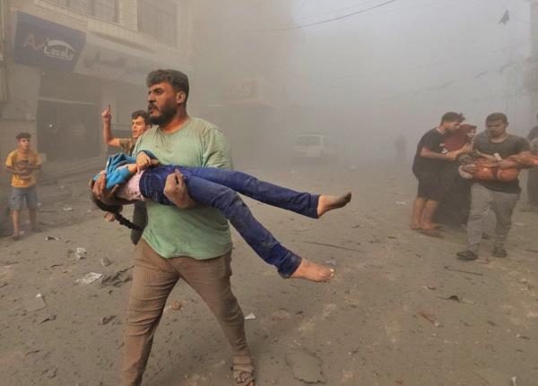 Palestinians search for casualties at the site of Israeli strikes on houses in Jabalia refugee camp in the northern Gaza Strip, on Oct. 31, 2023. 