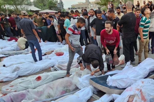 Bodies of Palestinians killed in Israeli strikes on houses in Jabalia refugee camp lie at a hospital in the northern Gaza Strip, on Oct. 31, 2023. 