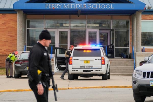 Law enforcement officers respond to a school shooting at the Perry Middle School and High School complex in Perry, Iowa.