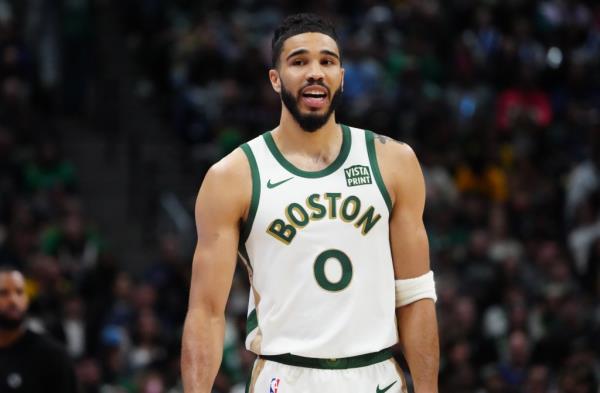 Boston Celtics forward Jayson Tatum (0) reacts in the first half against the Denver Nuggets at Ball Arena.