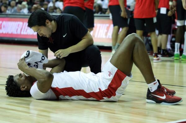 Amen Thompson of the Houston Rockets reacts after being injured against the Portland Trail Blazers.