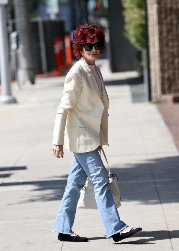 Sharon Osbourne waves at the paparazzi.