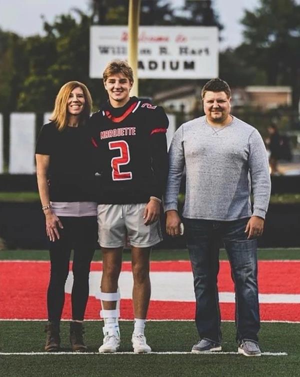 DeMay with his parents, John DeMay and Jennifer Buta