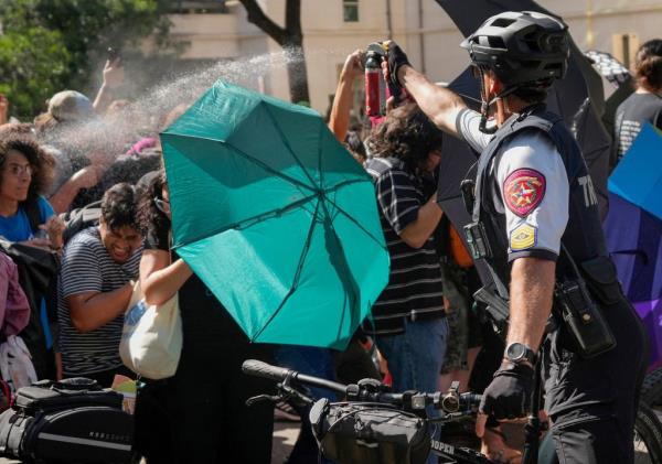 A state trooper pepper-spraying anti-Israel protesters at the University of Texas in Austin on April 29, 2024.