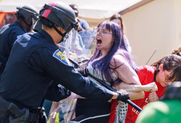 Police arresting protesters at Indiana University on April 25, 2024.