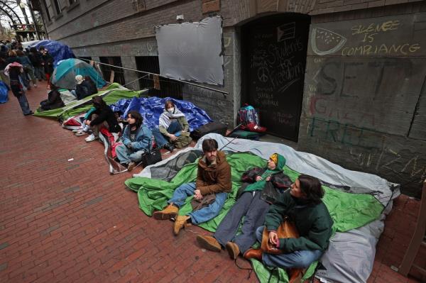 Students sitting in tents at Emerson College in Boston on April 24, 2024.