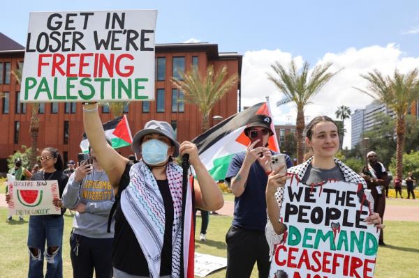 Students holding signs at an anti-Israel rally at Arizona State  on April 26, 2024.