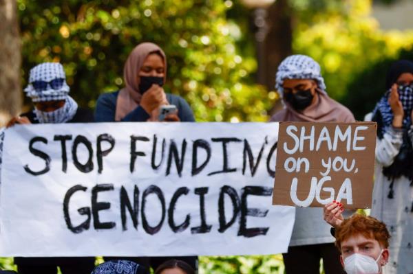 Students holding signs at a protest on the University of Georgia campus on April 29, 2024.