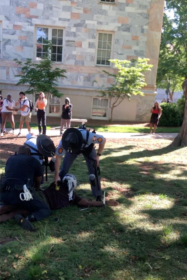 A protester getting tasered by law enforcement officers at Emory University on April 25, 2024.