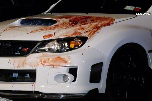 A white car smeared with blood.