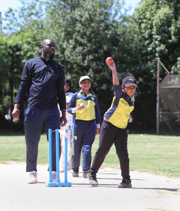 Hanish Sanjeepan, 9, bowls Saturday, June 8, 2024, during a youth cricket clinic at Walker Park.