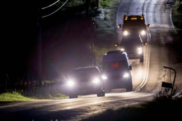 epa10941819 Law enforcement vehicles leave the area near the home of mass-shooting suspect Robert Card in Bowdoin, Maine, USA, 26 October 2023. Police are searching for suspect Robert Card following a mass shooting which killed 18 and injured 13 in nearby Lewiston, Maine, on 25 October 2023. EPA/CJ GUNTHER