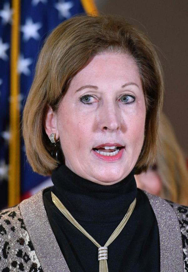 (FILES) Sidney Powell speaks during a press co<em></em>nference at the Republican Natio<em></em>nal Committee headquarters in Washington, DC, on November 19, 2020. In a potential blow to Do<em></em>nald Trump, Sidney Powell, one of his former lawyers, pleaded guilty on October 19, 2023, in the case alleging the former US president led a criminal co<em></em>nspiracy to overturn his 2020 election loss in the state of Georgia. (Photo by MANDEL NGAN / AFP) (Photo by MANDEL NGAN/AFP via Getty Images)