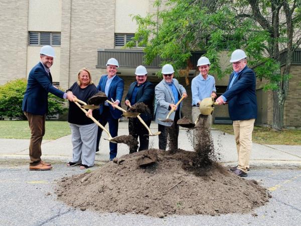  Ulster County Executive Pat Ryan with Legislators Gina Hansut, Thomas Corcoran and Peter Criswell, President of Pennrose Tim Henkel, Mayor Steve Noble and Chair of the Ulster County Housing Development Corporation Hayes Clement at the future home of Golden Hill housing project.