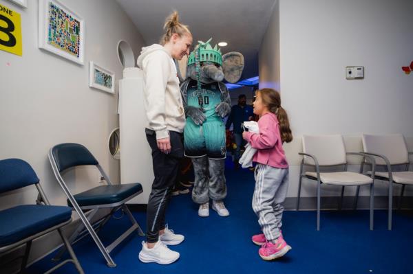 Courtney Vandersloot visits patients at the Lerner Children's Pavilion on Thursday.