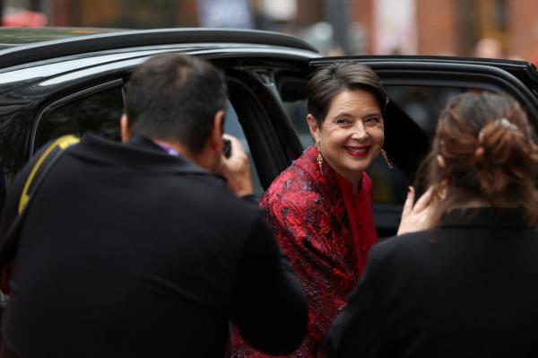 Isabella Rossellini getting out of a car