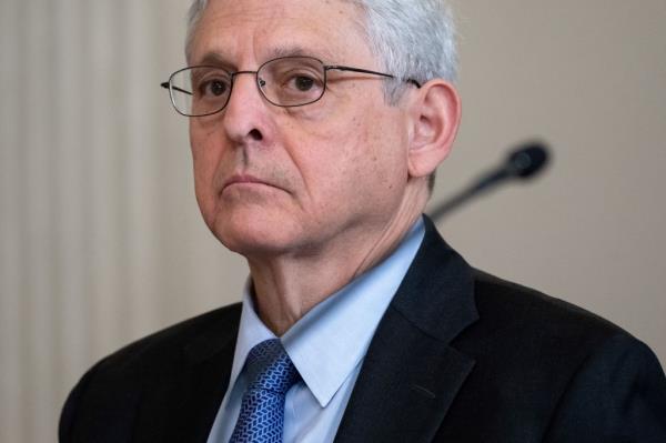 Attorney General Merrick Garland in a suit and tie at the Task Force on Reproductive Healthcare Access meeting in White House State Dining Room.