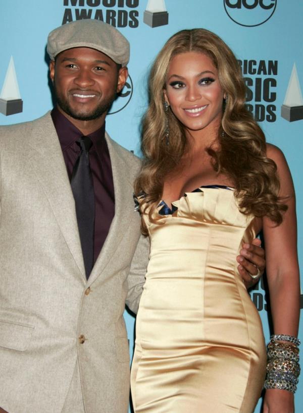 Usher and Beyo<em></em>nce pose in the press room at the 2007 American Music Awards.