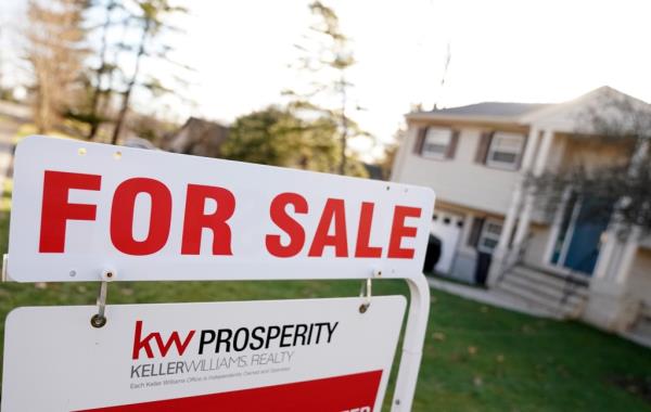 A 'For Sale' sign in front of a house in North Haledon, New Jersey on December 19, 2023