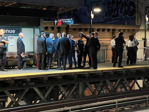 An NYPD vehicle is seen outside the taped-off Marcy Avenue station after the fatal stabbing.