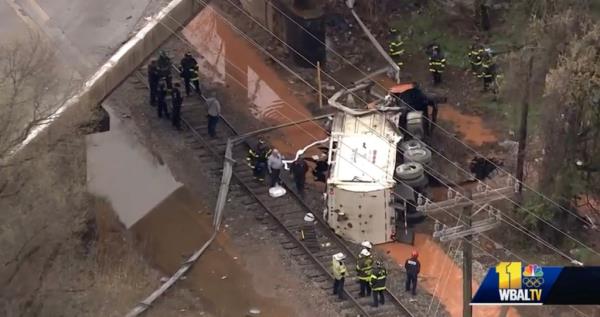 One person was killed after a garbage truck drove off an exit ramp bridge in Baltimore.