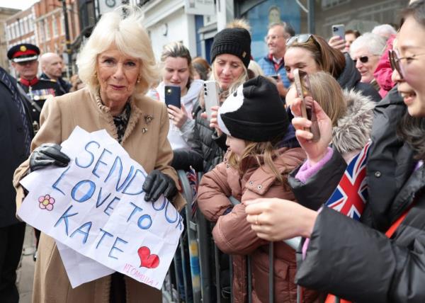 Queen Camilla receiving a message of support from well-wishers at the Farmers' Market in Shrewsbury, UK.