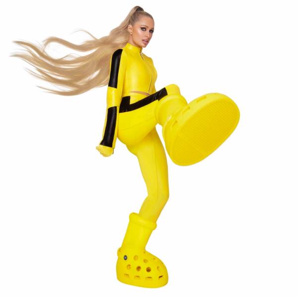 Paris sporting the yellow MSCHF x Crocs boots