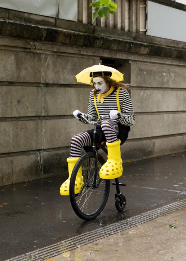 Tommy Cash on old fashio<em></em>ned bike dressed as a mime.