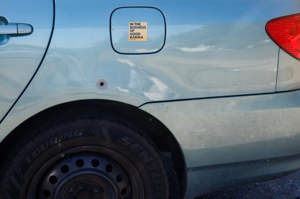 A car parked outside the Edge is marked withy a bullet hole.