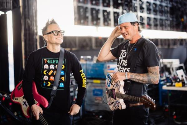 With Bl<em></em>ink-182 bandmate Mark Hoppus at Coachella in April 