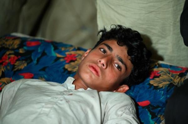 Ibrar Ahmad, a survivor of the cable car accident receives aid at a healh care center in the Pashto village of mountainous Khyber Pakhtunkhwa province on August 23, 2023, a day after being rescued from a chairlift that plunged into a ravine. Military helicopters and ziplining commandos rescued eight people, including six schoolboys, who were trapped for hours on August 22, in a stricken cable car high above a remote Pakistani valley. (Photo by Farooq NAEEM / AFP) (Photo by FAROOQ NAEEM/AFP via Getty Images)