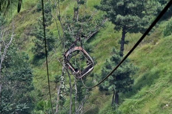 This photograph shows a view of the chairlift cable in the Pashto village of mountainous Khyber Pakhtunkhwa province on August 23, 2023, a day after it broke sending passengers plunging into a ravine. Military helicopters and ziplining commandos rescued eight people, including six schoolboys, who were trapped for hours on August 22, in a stricken cable car high above a remote Pakistani valley. (Photo by Farooq NAEEM / AFP) (Photo by FAROOQ NAEEM/AFP via Getty Images)