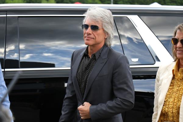 Jon Bon Jovi arrives at former New England Patriots quarterback Tom Brady's Hall of Fame induction at Gillette Stadium.