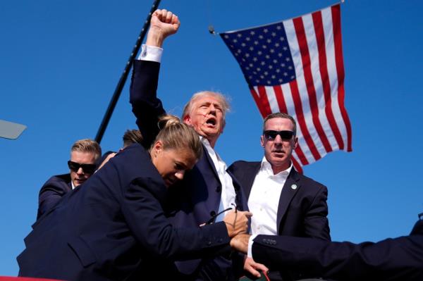 Republican presidential candidate former President Do<em></em>nald Trump is surrounded by U.S. Secret Service agents at a campaign rally, Saturday, July 13, 2024, in Butler, Pa.