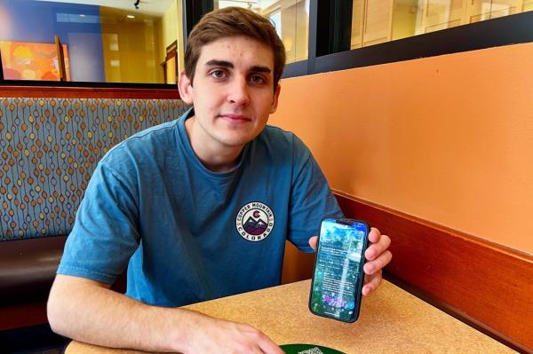 Jack Sweeney displays @elo<em></em>njet on his phone on June 23, 2022 in Clermont, Fla.