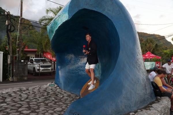 Colin Jost reporting on the surfing competition in the Olympics