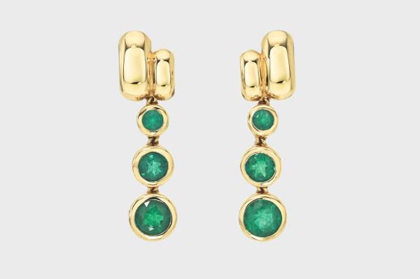 A pair of gold Retrouvai earrings with green stones