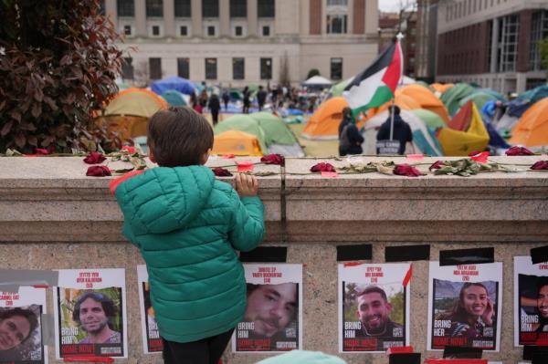 People gather at a pro-Palestinian encampment on the lawn of Columbia University on Saturday, April 27, 2024 in New York.