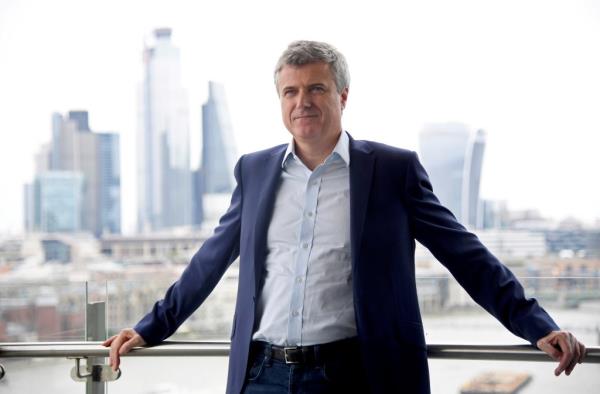 Mark Read, CEO of WPP, posing for a portrait in front of a cityscape at the Lo<em></em>ndon office