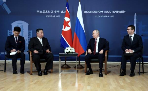 Vladimir Putin is seen meeting with North Korea's Kim Jong Un in Russia Wednesday.